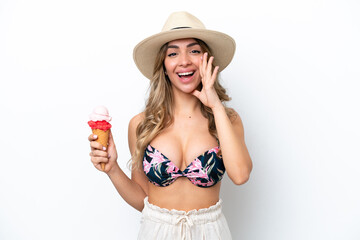 Girl wearing a swimsuit and holding cornet ice cream isolated on white background shouting with mouth wide open