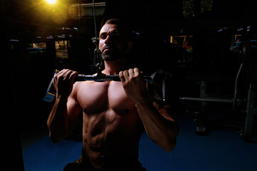 Fototapeta na wymiar very strong man training in the gym