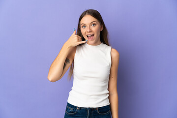 Young Lithuanian woman isolated on purple background making phone gesture. Call me back sign