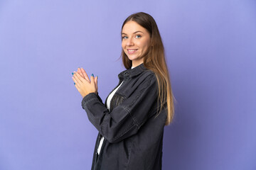 Young Lithuanian woman isolated on purple background scheming something