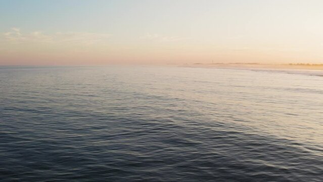 Drone footage of a sunset on the ocean