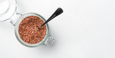 Flax seeds on a gray background. Healthy food, rich in omega 3.