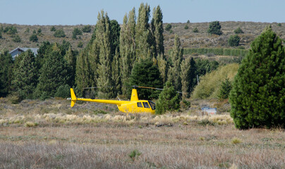 yellow helicopter on the ground