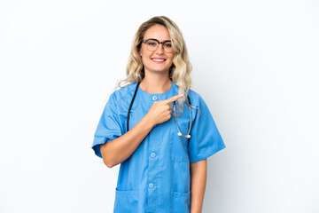 Brazilian surgeon doctor woman over isolated background pointing to the side to present a product