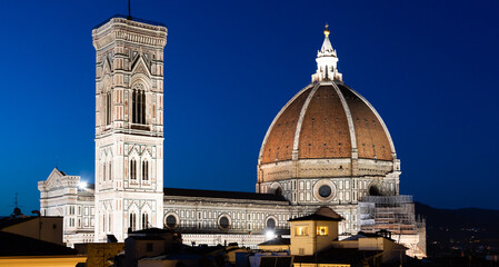 Fototapeta na wymiar Florence Duomo and Campanile - Bell Tower - architecture illuminated by night, Italy. Urban scene in exterior - nobody.