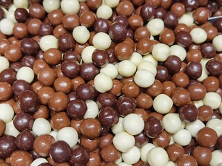 Hazelnuts coated in white and dark chocolate
