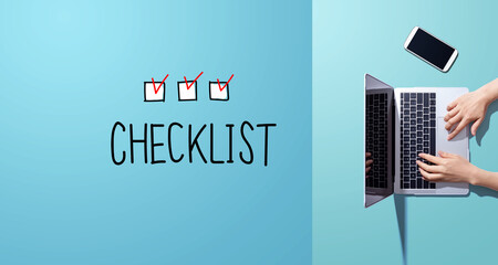 Checklist with person working with a laptop