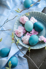 Beautiful blue Easter eggs. Gradient color transition. Easter traditional treats and festive table decor