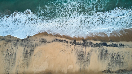 Aerial view of an emerald green sea and big foaming waves. Indian Ocean. Dikwella beach. Sri Lanka. High quality photo