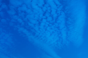 Intense blue cold chemtrail sky, abstract blue background
