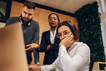 Stressed business team having a meeting in the office and solving a problem