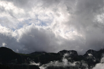 Rugged Hillside  with Low Clouds