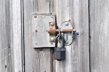 Old Timber Door with Metal Padlock and Bolt in Close Up 