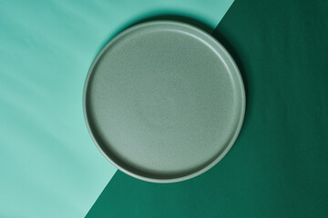 pistachio green plate on background. Green monochrome.