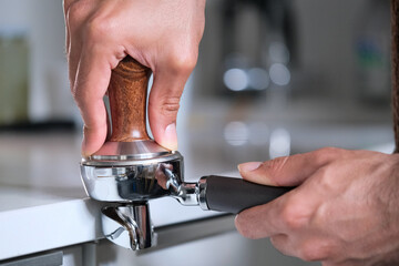 the person making a coffee