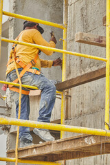 Men working on the construction of houses and buildings, masons, contractors. Construction tools. Pasting floors.
