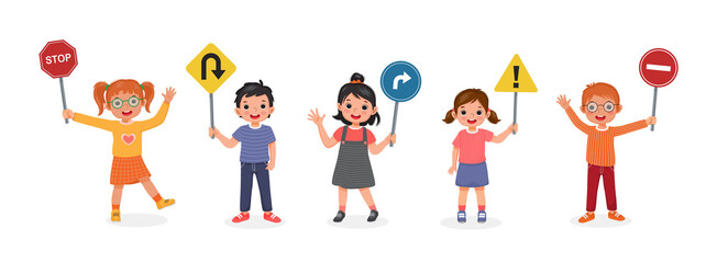 Group of cute kids holding traffic road signs such as stop, u turn, turn right, caution, and no entry sign 