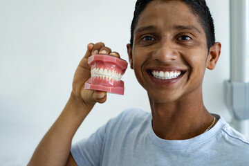 Man satisfied with dental orthodontic procedures.