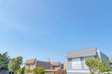 Suburban houses with asphalt shingle roofs and trees outdoors in San Francisco, California