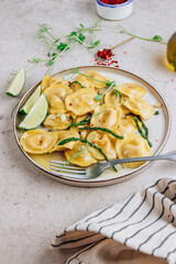 Italian cheese ravioli with roasted asparagus in herbed lemon butter sauce