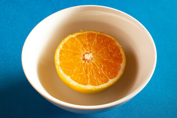 orange on a blue plate