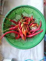 red hot chili peppers in a basket flat lay shot