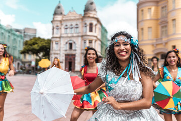 Frevo dancers at the street carnival in Recife, Pernambuco, Brazil. - obrazy, fototapety, plakaty