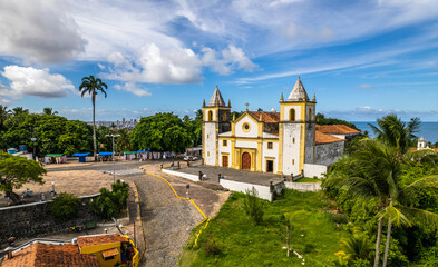 Aerial view of the city of Olinda in Alto da Sé with church, houses, sea and movement of people. - obrazy, fototapety, plakaty