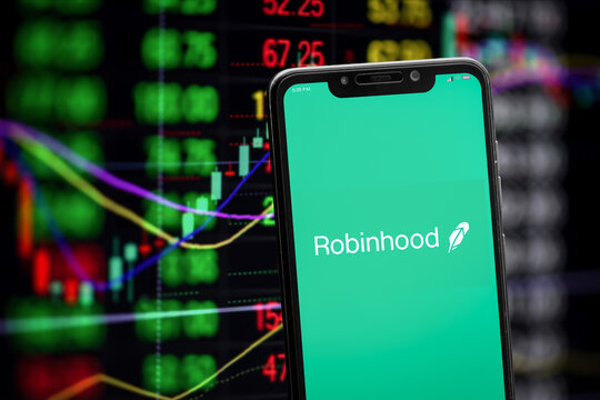 Cali, Colombia - April 22 2022: Robinhood logo on the smartphone screen and the concept of trading stock markets at the blurred background.