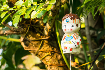 Bangkok, Thailand - April, 15, 2022 : Colorful cheramic dolls in the garden restaurant at Bangkok, Thailand.