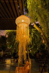 Bamboo lantern hanging in a restaurant at thailand.