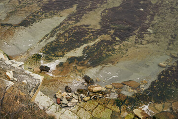 Image of the rocky shores of the cold sea.