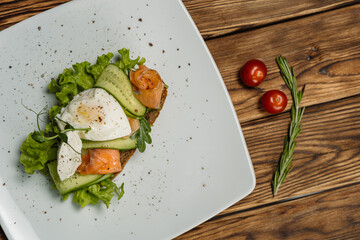 sandwich with salmon and vegetables