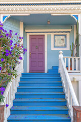 Home exterior with blue doorsteps and wall sidings at San Francisco, California
