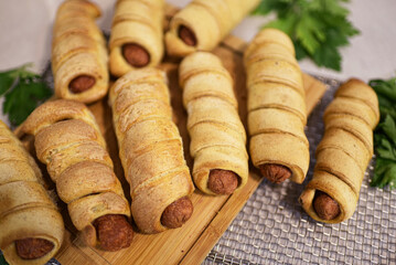 Delicious snack of sausages wrapped in puff pastry.