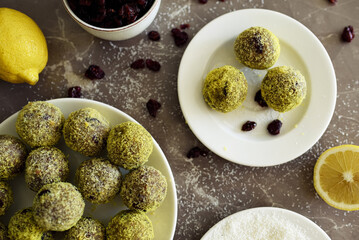 Chocolate, lemon cake  balls with coconut flakes.