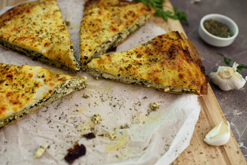 Traditional homemade pie with spinach and cheese.