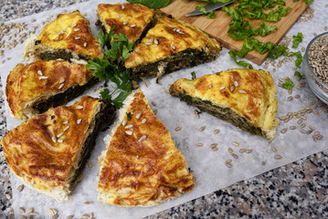 Traditional homemade pie with spinach and cheese.