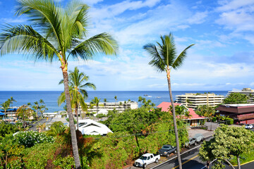 Fototapeta na wymiar Ocean view of beach resort area with palm trees in Kona on the Big Island of Hawaii
