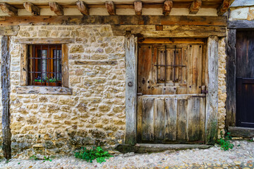 Fototapeta na wymiar Medieval facade of stone house in Calatanazor, Soria, Spain.