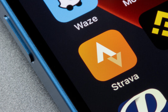Portland, OR, USA - Apr 21, 2022: Strava mobile app icon is seen on an iPhone. Strava is an American internet service for tracking physical exercise which incorporates social network features.