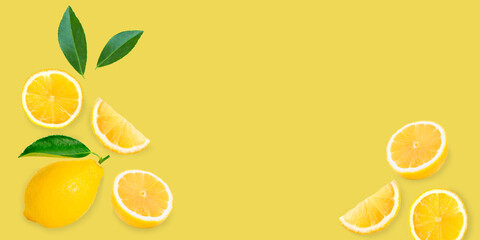 Lemon with slices and green leaves isolated on yellow background. Flat lay, top view, copy space.