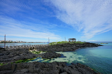beautiful seascape with gazebo and charming clouds