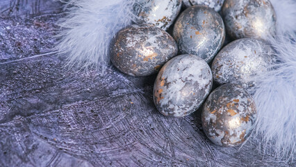 Easter card with a copy of the place for the text. Very Peri 2022 .Purple, blue eggs in a basket on a dark newspaper background. Natural dye karkade tea.