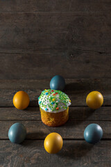 Painted eggs for Easter in the colors of the flag of Ukraine and Easter cake. Yellow and blue...