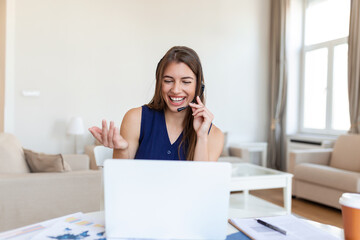 Shot of a businesswoman on a video call while sitting at her desk.Cropped shot of an attractive young woman using her laptop to make a video call at home