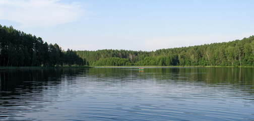 Fototapeta premium Lake in the Forest. Still lake. Summer. Peaceful Landscape