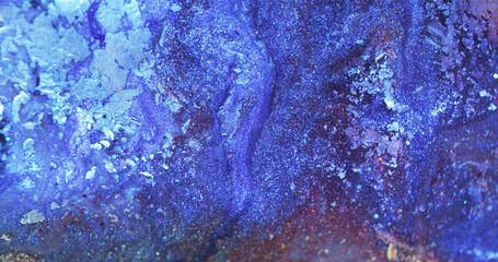 Glitter fluid texture. Paint mix. Ice frost pattern. Defocused blue purple color sparkling particles decorative abstract background.