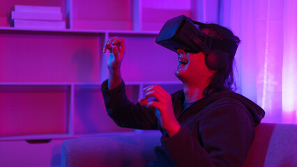 Metaverse technology concept, Man wear VR goggles and have fun to touch experience in virtual world