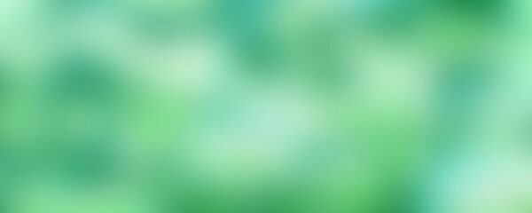 Abstract blurred bokeh green leaves background